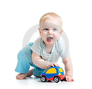 Funny boy baby playing with toy car