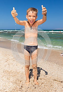 Funny boy on the beach