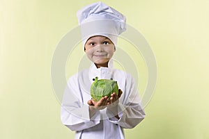 Chef keeps in his hands a cabbage