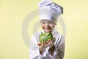 Chef keeps in his hands a cabbage