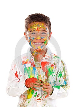 Funny boy with hands and face full of paint