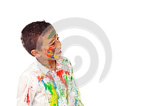 Funny boy with hands and face full of paint