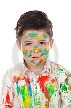 Funny boy with hands and face full of paint