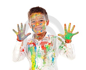 Funny boy with hands and face full of paint