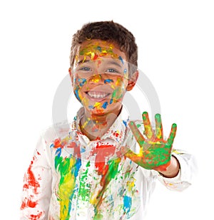 Funny boy with hands and face full of paint