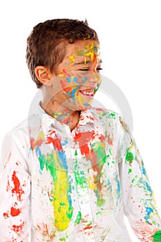 Funny boy with hands and face full of paint