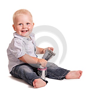 Funny boy holds small toys buckets in his hands