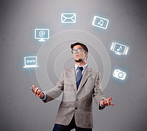 Funny boy juggling with electronic devices icons