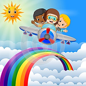 Funny boy riding plane over rainbow