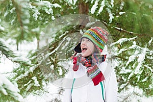 Funny boy screaming of joy playing snow ball