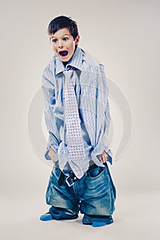 Funny boy wearing Dad`s clothes