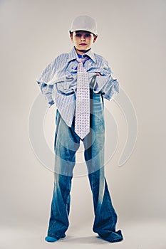 Funny boy wearing Dad`s clothes