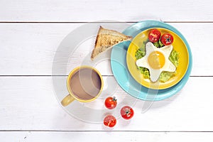 Funny Breakfast with star-shaped fried egg, toast, cherry tomato