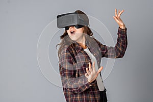 Funny brunette woman testing virtual reality helmet