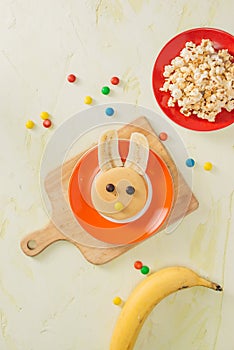 Funny bunny pancakes with fruits for Easter kids breakfast