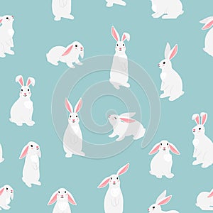 Funny bunny pets seamless pattern. Chinese new year symbol. White furry hares isolated on blue background. Cartoon cute