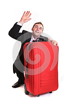 Funny business man hide behind red luggage