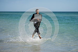 Funny business man in suit on sea. Summer vacation, business on sea beach. Summer rest, business people concept