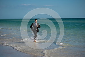 Funny business man in suit on sea. Summer vacation, business on sea beach. Summer rest, business people concept