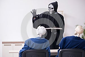 Funny business meeting with devil and skeletons