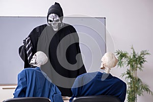 Funny business meeting with devil and skeletons