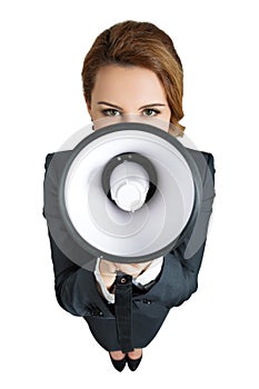 Funny business woman shouting with a megaphone