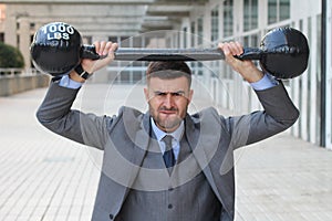 Funny businessman lifting heavy weights