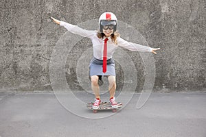 Funny businesswoman riding skateboard outdoor