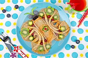 Funny Butterfly face pancakes with berries and fruits for kids`