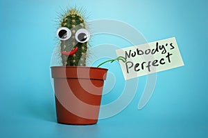 Funny cactus with sign Nobody is perfect