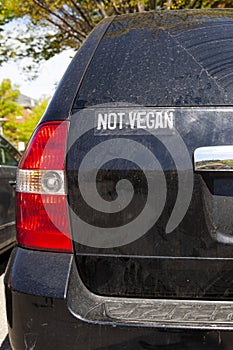 Funny car sticker on the back of an SUV that says ` Not Vegan