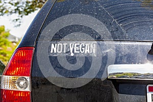 Funny car sticker on the back of an SUV that says ` Not Vegan