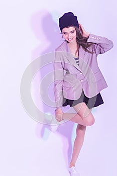 Funny Caucasian Brunette Girl Standing With Lifted Leg in Skirt