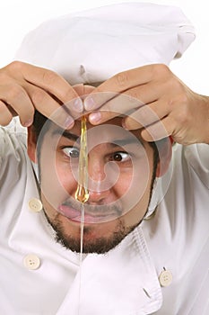 Funny chef cracking an egg