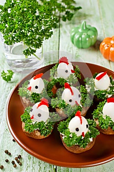 Funny chickens from eggs on the Easter table