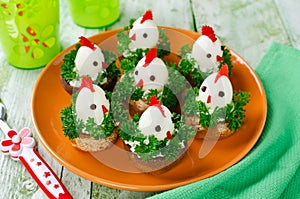 Funny chickens from eggs on the Easter table