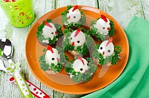 Funny chickens from eggs on the Easter table