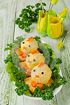 Funny chickens from eggs on the Easter table