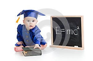 Funny child in academician clothes at chalkboard