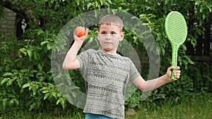 Funny child boy looking at camera. Happy childhood. Happy child. Portrait of cute boy looking serious pensive at camera on country