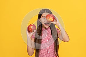 funny child eating healthy food. childhood health. natural organic fresh apple. healthy life.