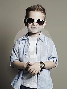 Funny child. fashionable little boy in sunglasses