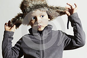 Funny child in fur Hat.Kids fashion casual winter style.little boy.children emotion