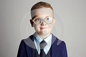 Funny child in glasses. little boy in suit