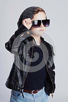 Funny child in hat.fashionable little boy in sunglasses.stylish kid in leather