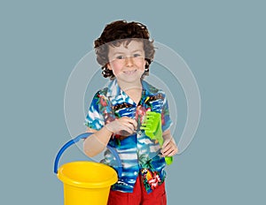 Funny child in holidays with a bucket and shovel