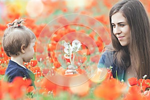 Funny child outdoor at poppy field