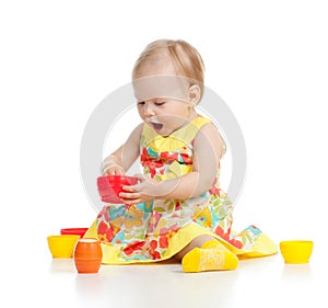 Funny child playing with toys