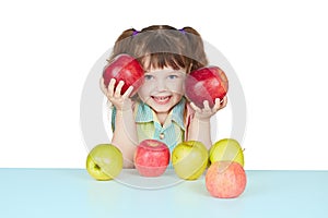 Funny child playing with two red apples