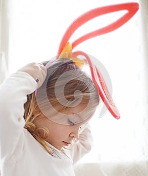 Funny child in rabbit ears